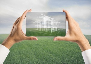 Architect holding a tablet with a new house image on the screen, domain name real estate concept.