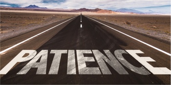 Desert road with the word "Patience" written on the road. Waiting for the right Domain buyer concept.