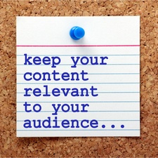 "Keep Your Content Relevant to Your Audience" in blue text on a note card pinned to a notice board. Concept for keeping up-to-date with applicable content for your marketing efforts.