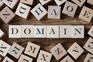 The word “DOMAIN” is displayed on cubes.