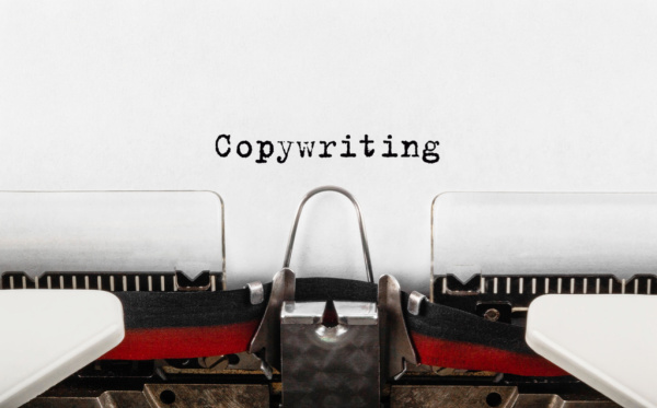 The word “Copywriting” is typed on a retro typewriter.