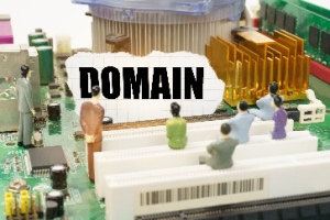 The motherboard shows figures of people and torn paper labeled "Domain," symbolizing technology concepts. The concept also represents the future of domain names.